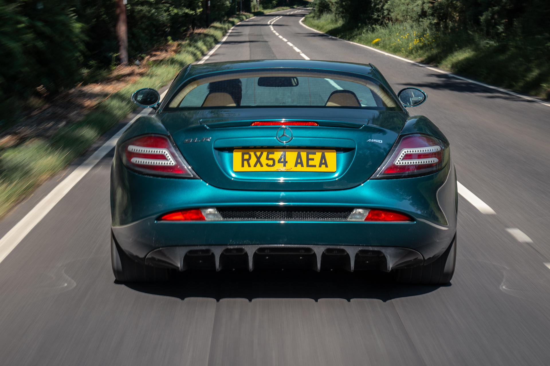 Mercedes SLR McLaren driving on the road behind