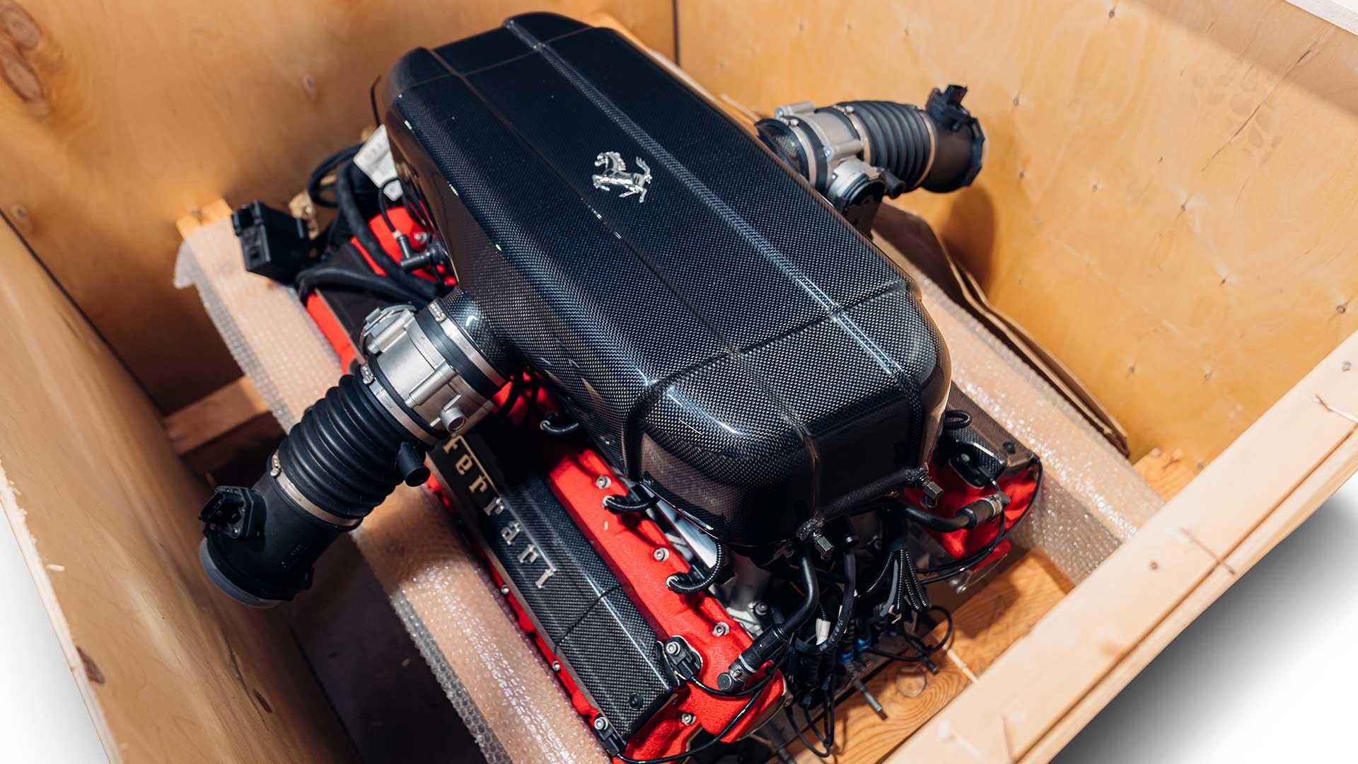 A Ferrari Enzo engine in a diagonally forward crate