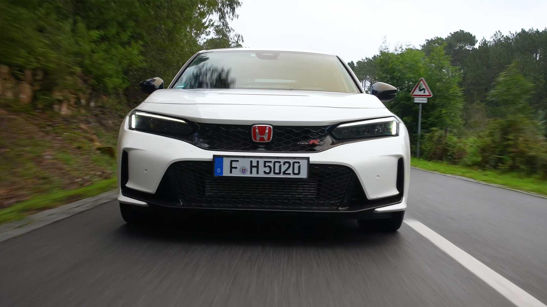 Honda CIvic Type R driving on a road front