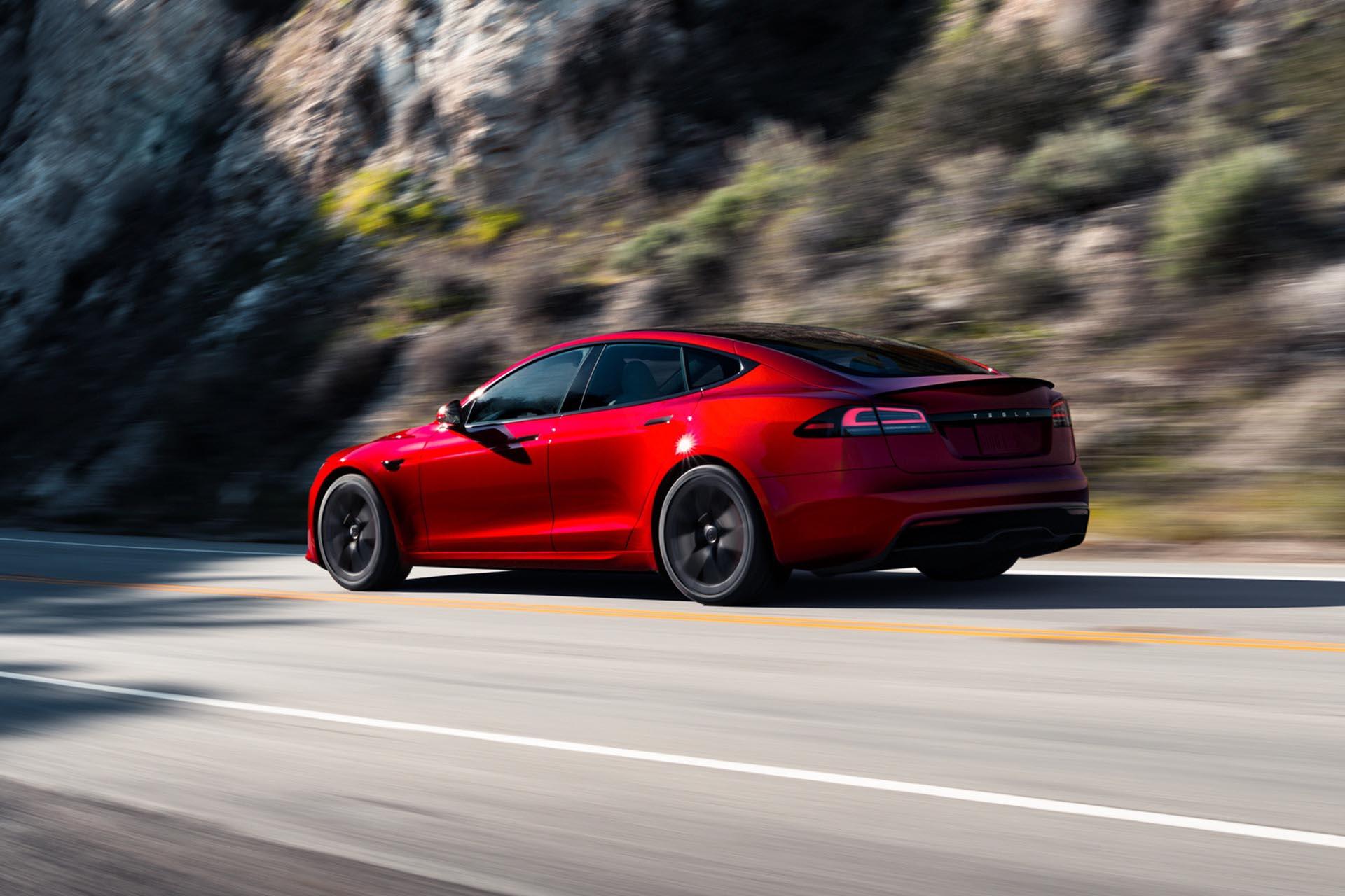 Tesla Model S Plaid (2023) driving diagonally behind