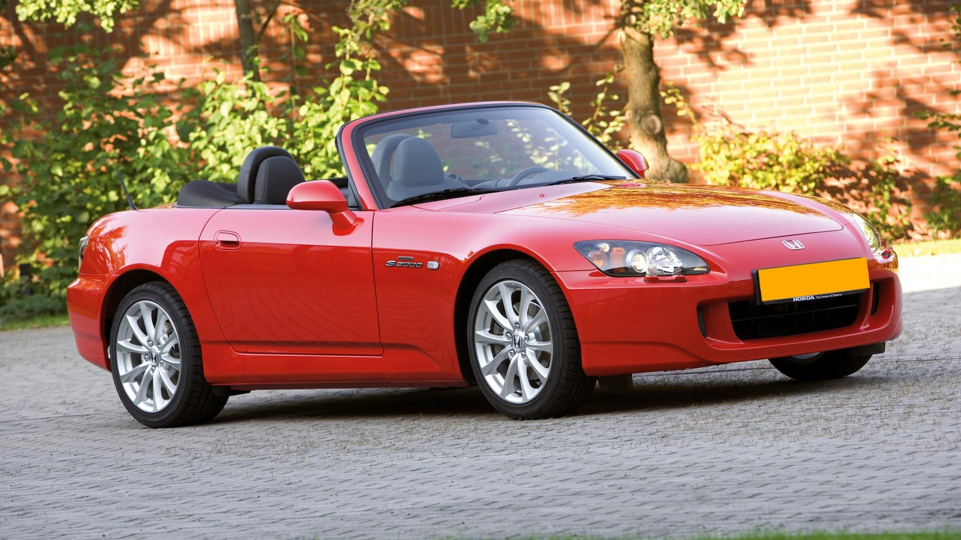 Honda S2000 (AP2) rood (2003) zijkant voor schuin voor rechts dak omlaag