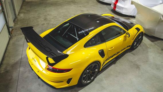 Porsche 911-collectie te koop met vrachtwagen en trailer 911 GT3 RS schuin achter boven