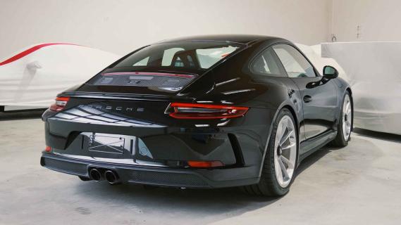 Porsche 911-collectie te koop met vrachtwagen en trailer 911 GT3 Touring schuin achter