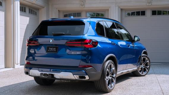 BMW X5 25 Jahre blauw zijkant achter