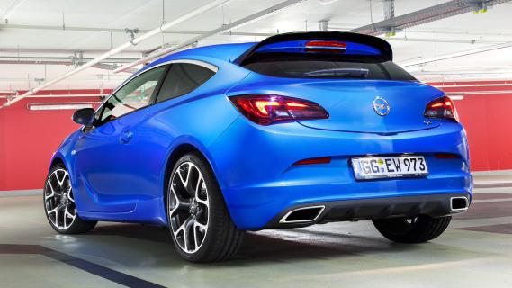 Opel Astra OPC (2012) blauw zijkant achter schuin links garage