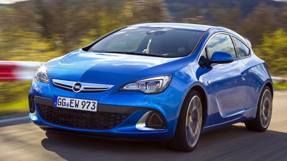 Opel Astra OPC (2012) blauw bocht zijkant links schuin rijdend