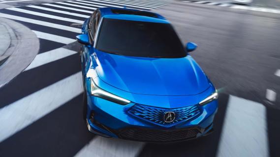 Acura Integra A-Spec blauw (2025) voorzijde rijdend door bocht