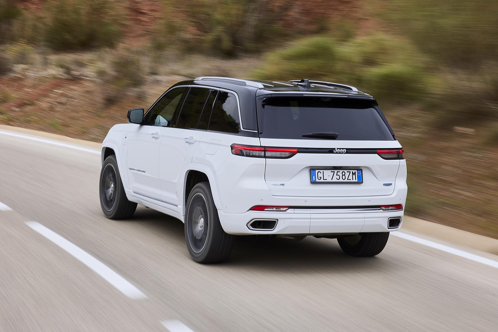 Jeep Grand Cherokee 4xe hybrid driving diagonally from behind