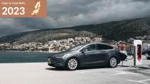 Cape to Cape Rally 2023 MisterGreen advertorial - Tesla Model X aan laadpaal naast meer