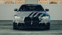 BMW M4 G82 met camouflage in de pitsstraat van Spielberg
