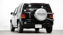 Achterkant Nissan Rasheen (Hummer ombouw)