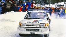 WRC Rally Zweden 1986 Juha Kankkunen en Juha Piironen rijdend in de sneeuw Peugeot 205