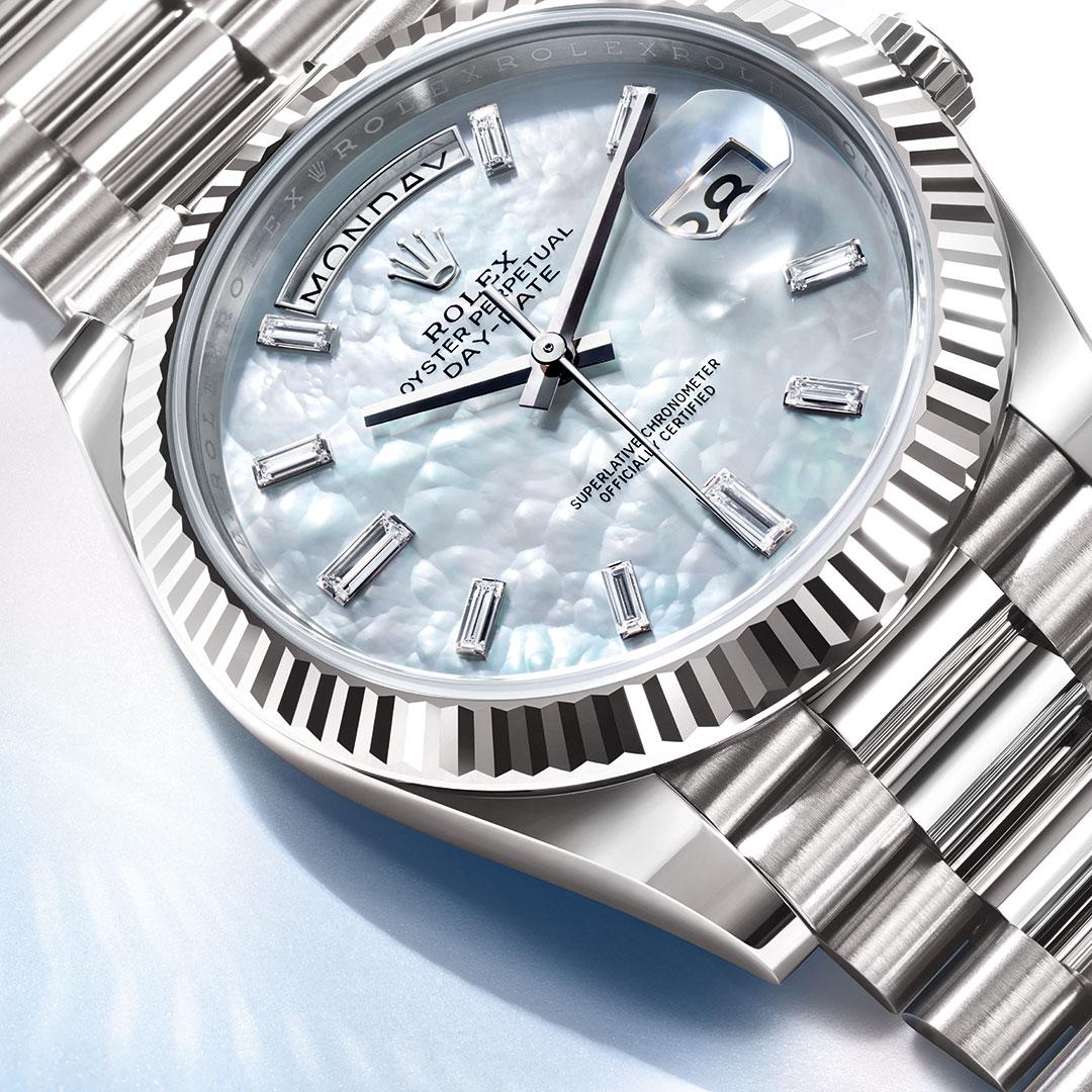 Rolex Oyster Perpetual Day-Date 40 ref. 228239-0078 White gold / White Mother-of-Pearl dial detail